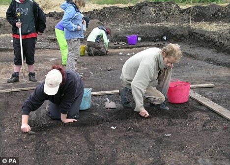 Scientists search an area at Starr Carr, North Yorkshire, last year after locating Britain's earliest house. Leading archaeologists today protested a law that requires all human remains unearthed at ancient settlements to be reburied