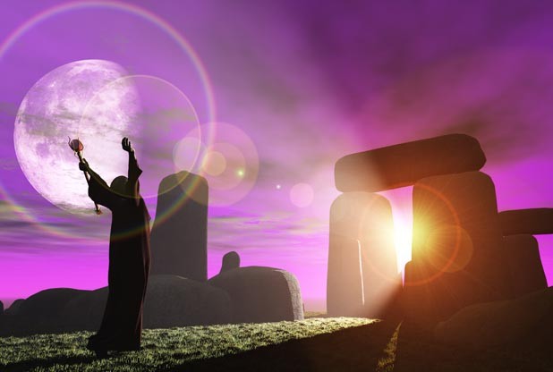 Druid greets the dawn at Stonehenge