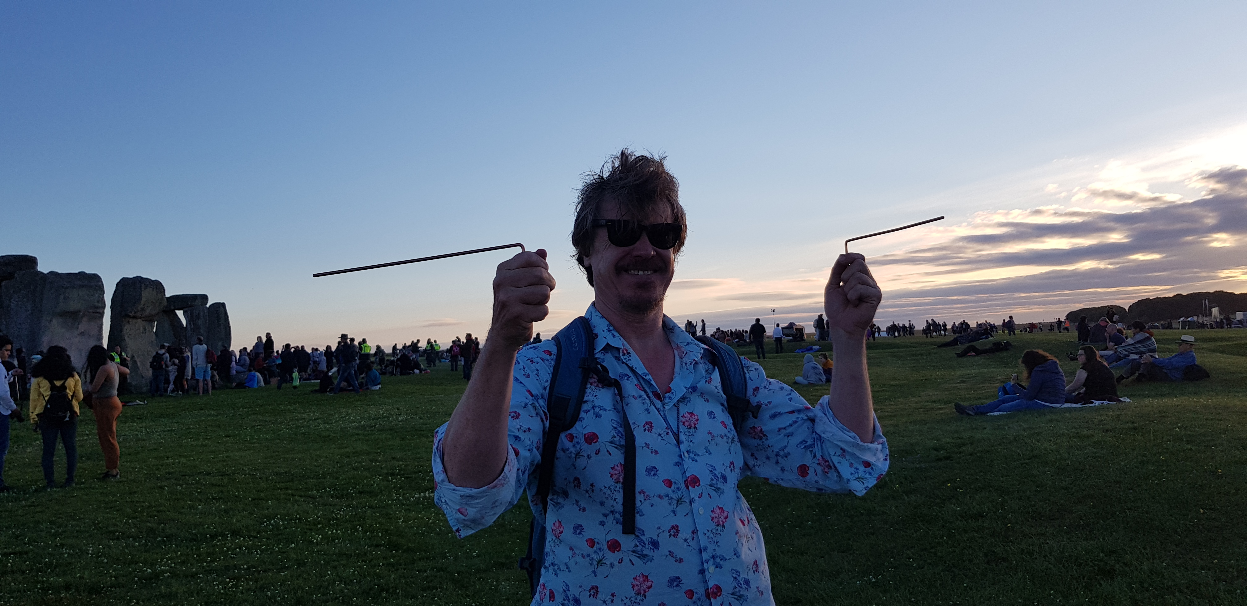 Dowsing the Stones at the Summer Solstice Celebrations. There is evidence that these straight tracks were used by the ancient peoples for spiritual purposes, and also for purposes such as trading and commerce. Photo of a tour guide demonstrating the ancient art divining.